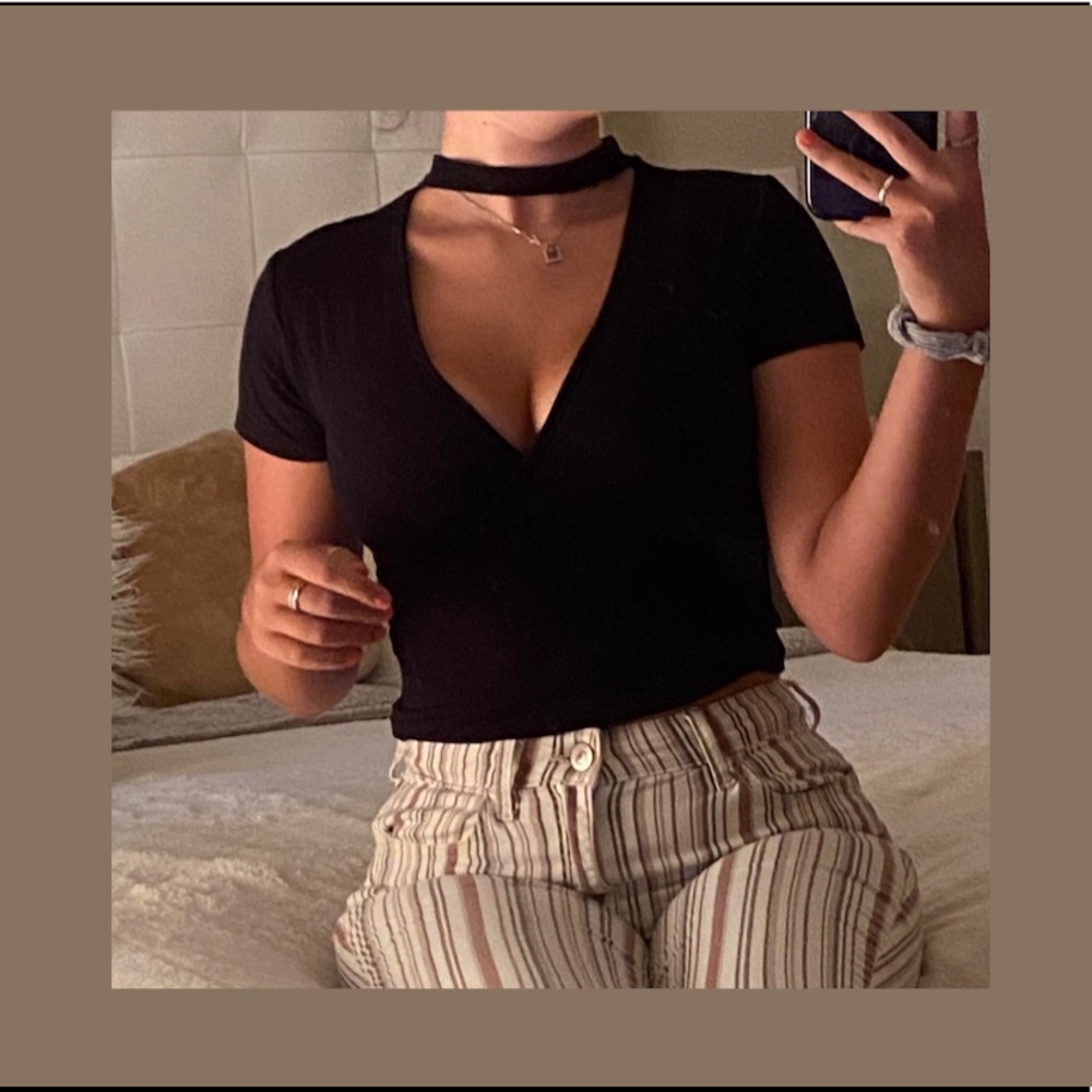SOLD       black wrap top bodysuit !